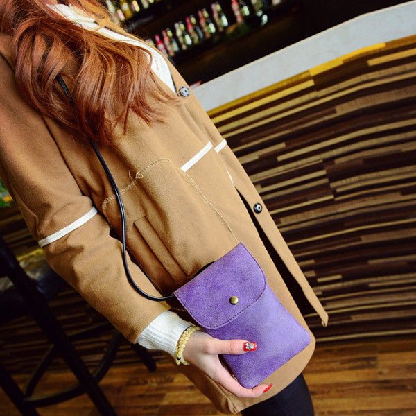 Purple suede crossbody pouch with front flap snap closure