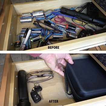 Flipo battery storage case, open in drawer with batteries, cables, and charger attachments