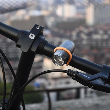 COB LED loop light attached to a bicycle handlebar with lens spotlight