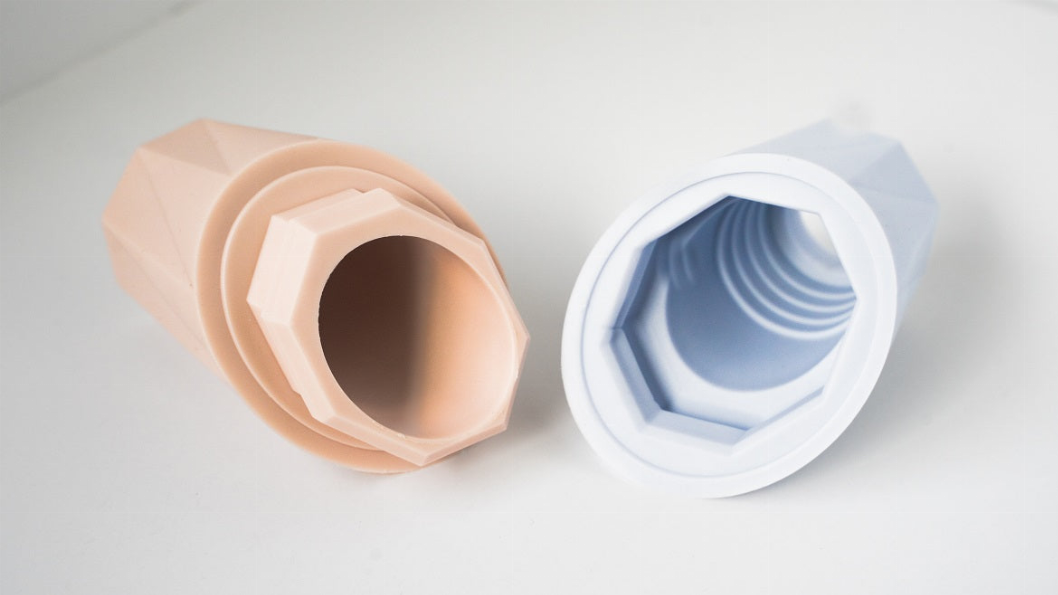 Light blue and pale pink treat filler chew toys, open ends for easy cleaning