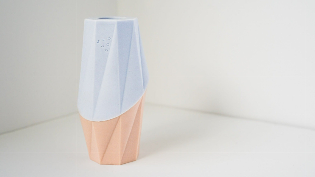 Light blue and pale pink treat filler chew toy with angled ridged shape