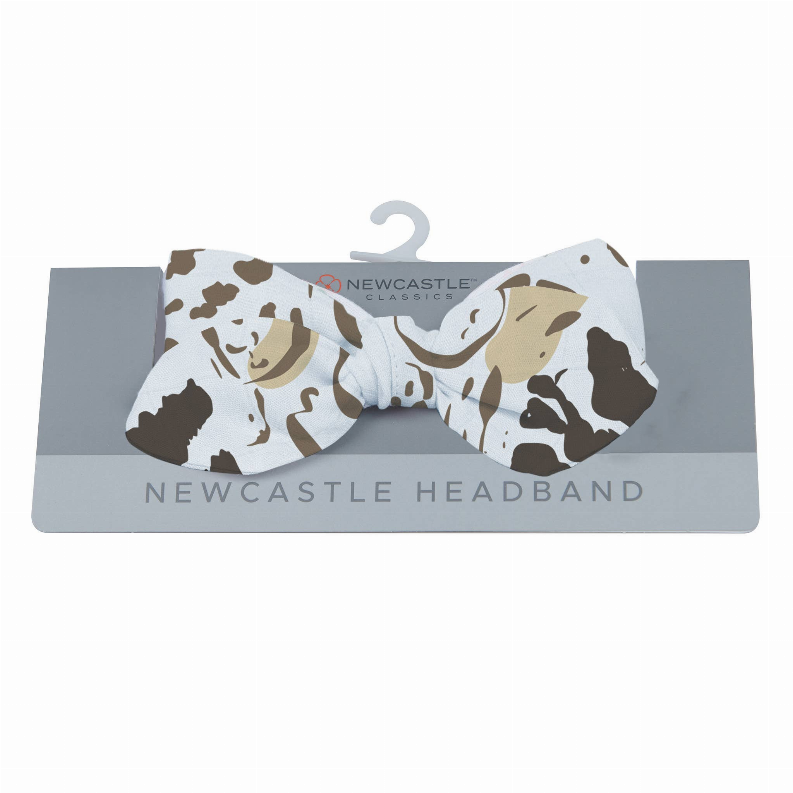 Animal print fabric headband with knotted center, beige and dark brown spots