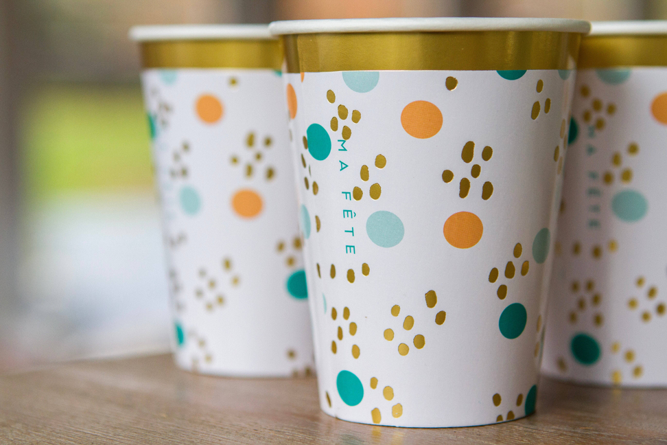 Fun fair cup, white paper with gold rim and colorful dot and paw-print pattern