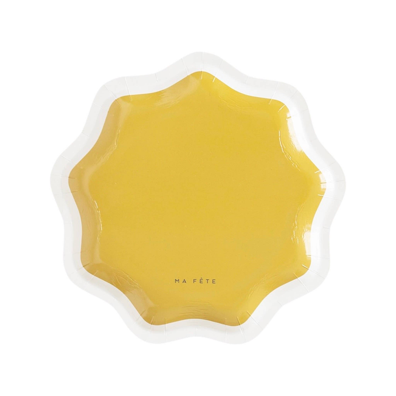 Yellow scalloped serving plate with white rim