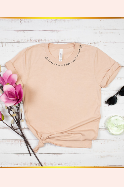 Peach short-sleeve crewneck T-shirt with small front text print