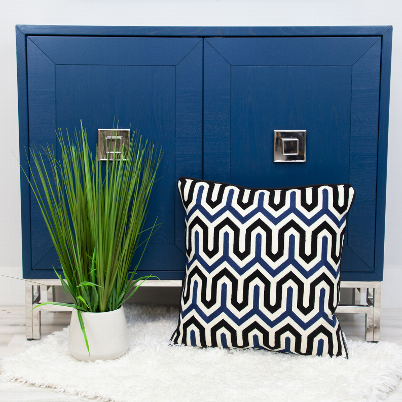 Square chevron-pattern throw pillow in blue, black, and white with dark border
