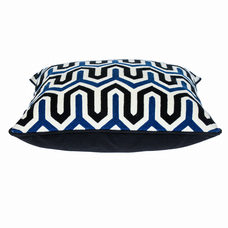 Square zigzag throw pillow showing blue, white, and black pattern with dark underside