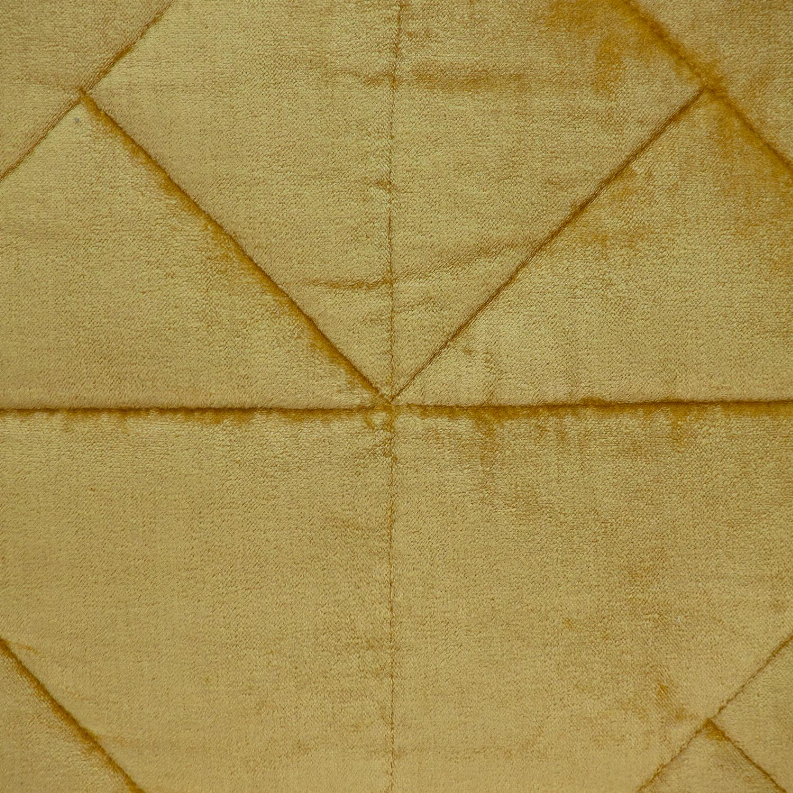Mustard yellow quilted pillow with stitched diamond grid and centered seam detail