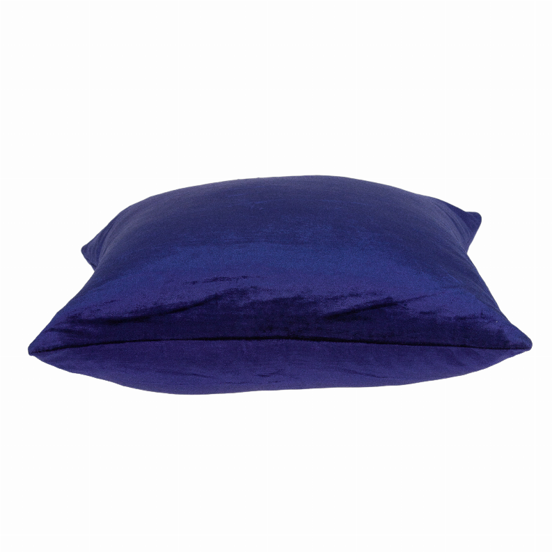 Royal blue solid throw pillow lying down with plush surface and neat edges.