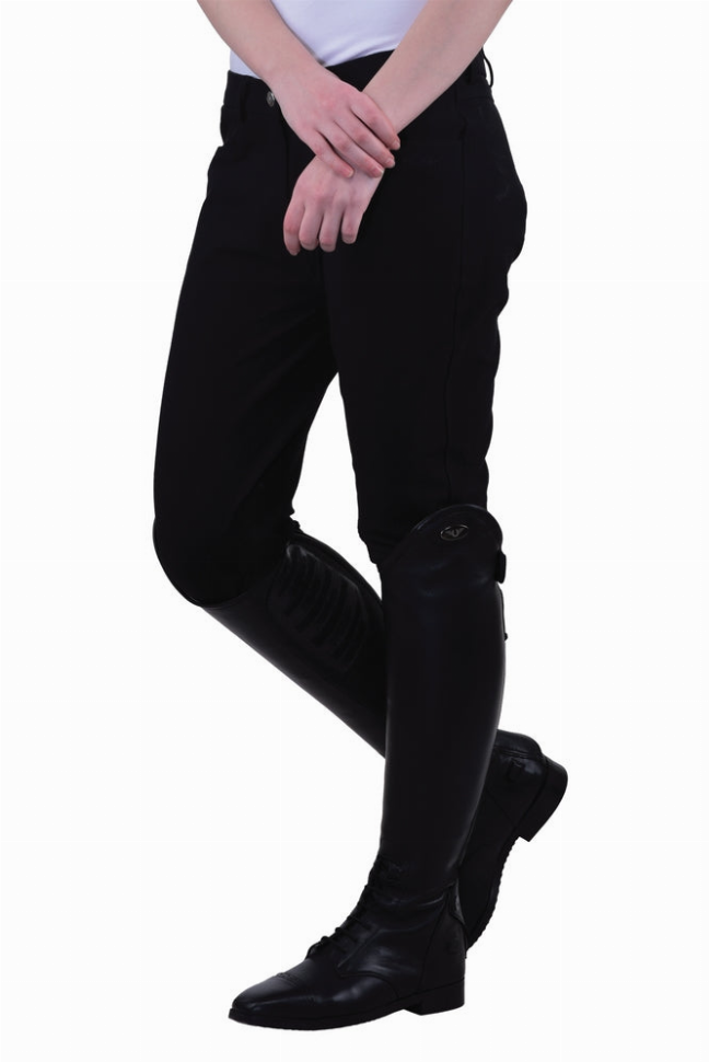 Black knee patch breeches close-up with glossy knee grip and boot