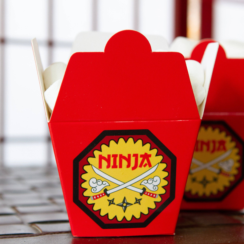 Red mini treat box holder with Ninja badge on the front