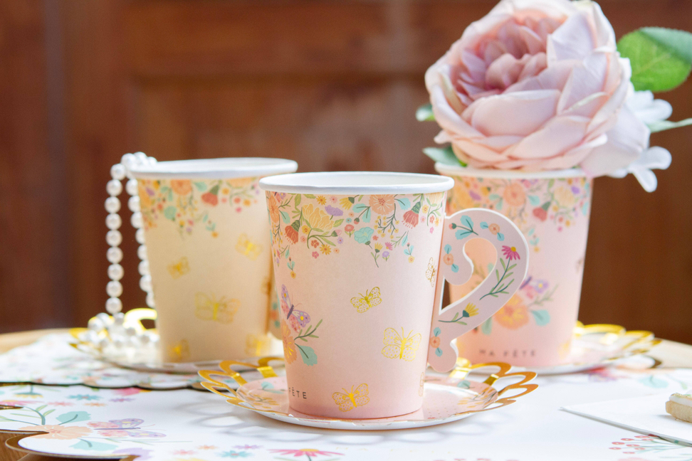 Floral tea party paper cup with matching saucer, butterfly and bee pattern