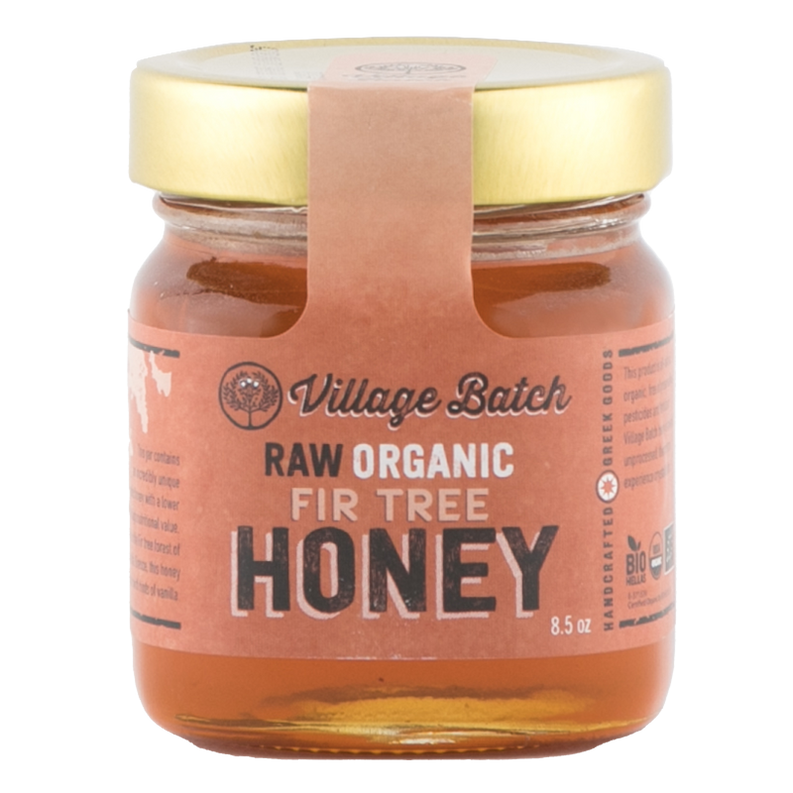 Raw organic fir tree honey jar with amber honey and paper seal