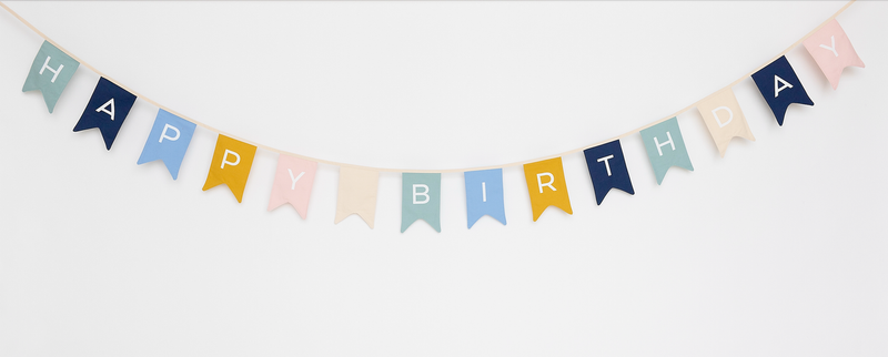 Multicolor fabric 'HAPPY BIRTHDAY' bunting with triangular flags on curved string