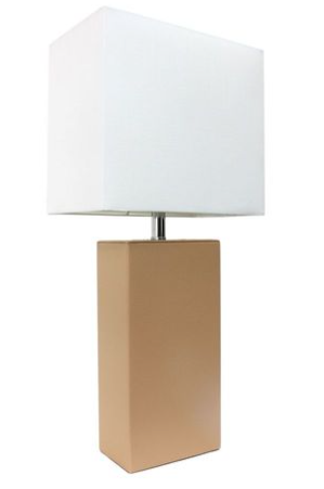 Modern table lamp with white fabric shade and tan leather base