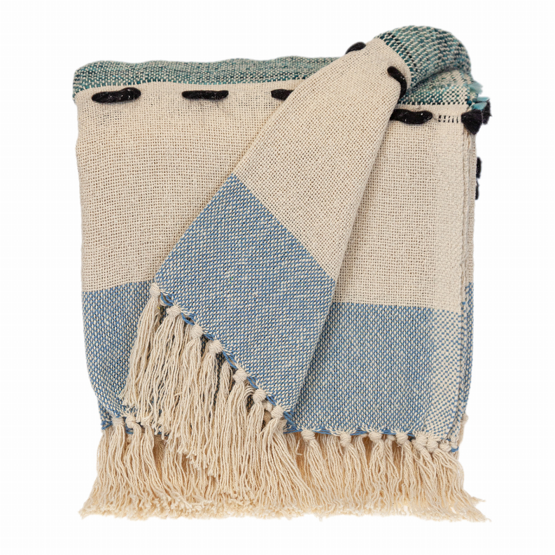 Woven throw blanket with cream and light-blue diamond panels, fringed edges, black tassels.