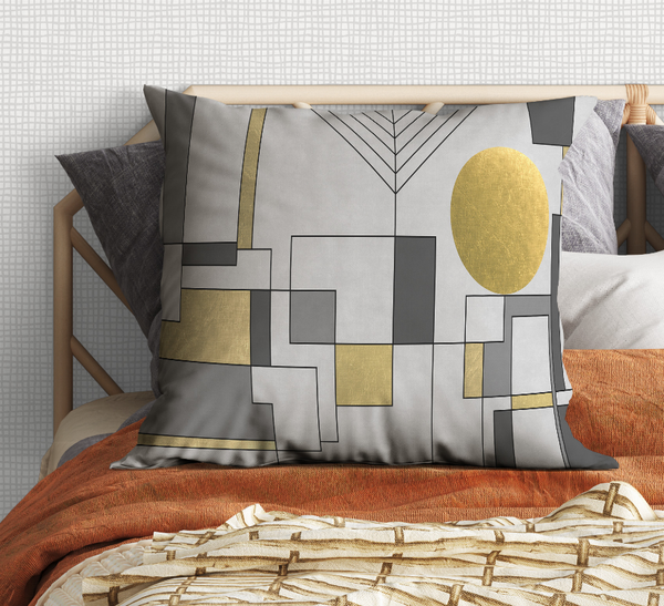 Geometric square pattern decorative pillow with gray, black, and gold accents
