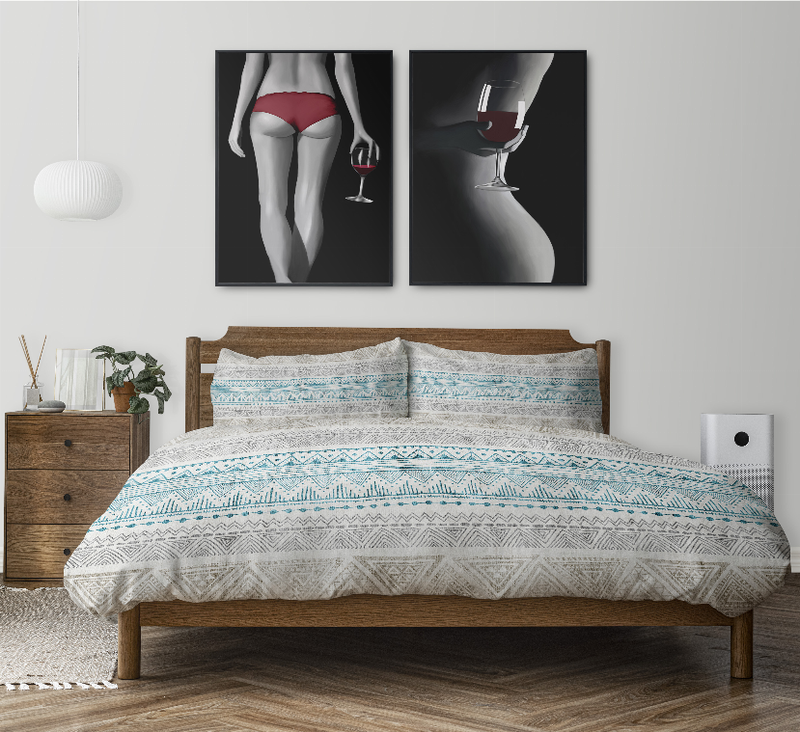 Blue and white geometric comforter set with two shams on a wooden bed frame