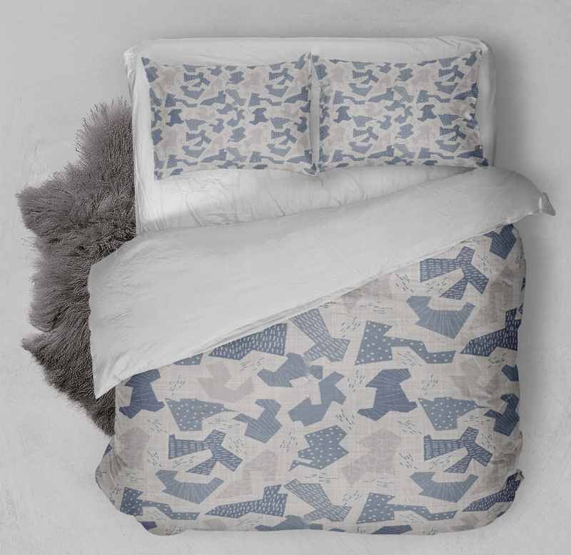 Blue and white patterned comforter set with pillow shams and duvet