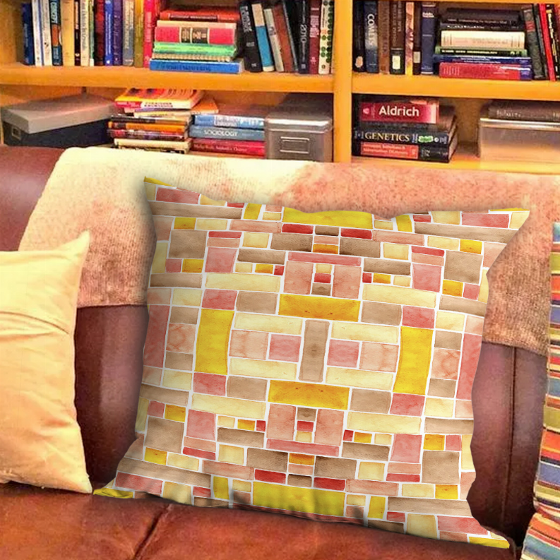 Multicolor throw pillow with multicolor brick-block pattern on sofa