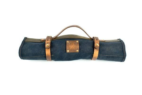 Closed blue tool roll pouch with brown leather belt straps and top carrying handle