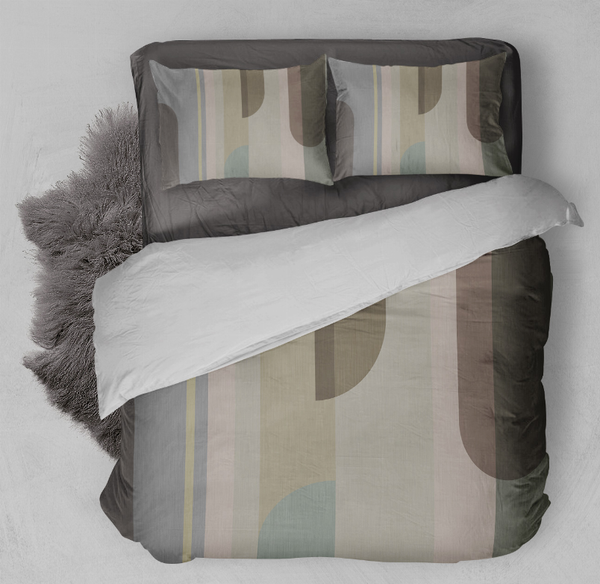 Comforter set with beige, gray, and teal geometric print and matching pillow shams