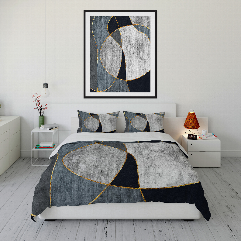 Comforter set with abstract circle and line pattern in gray, dark blue, and gold; with shams