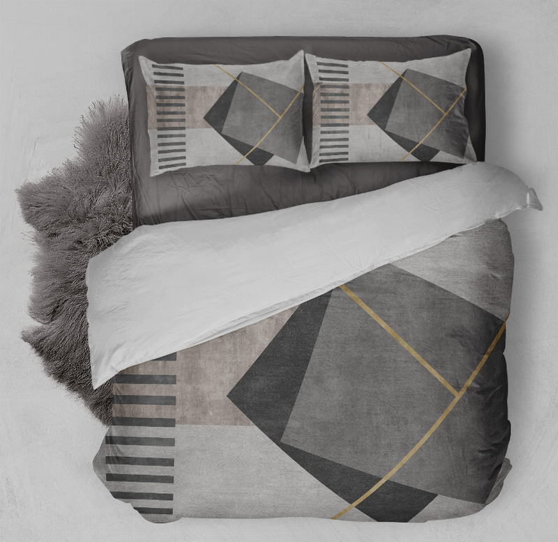 Comforter set with gray and white comforter, black diamond shapes, and yellow accent lines