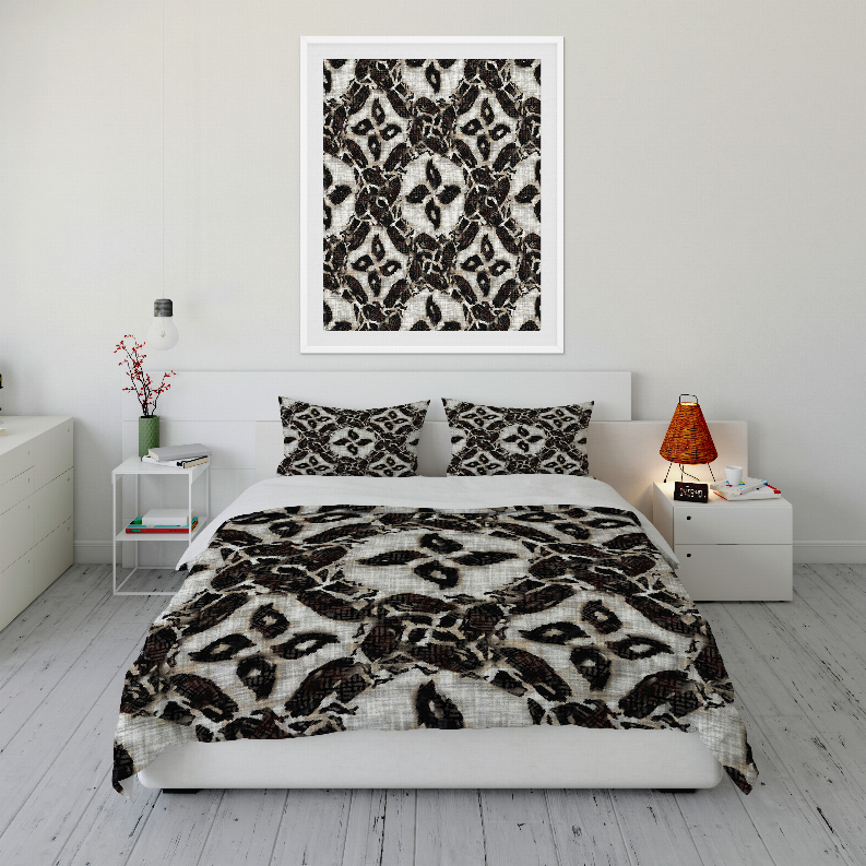 Comforter set featuring black-and-white leopard pattern on duvet with two standard shams