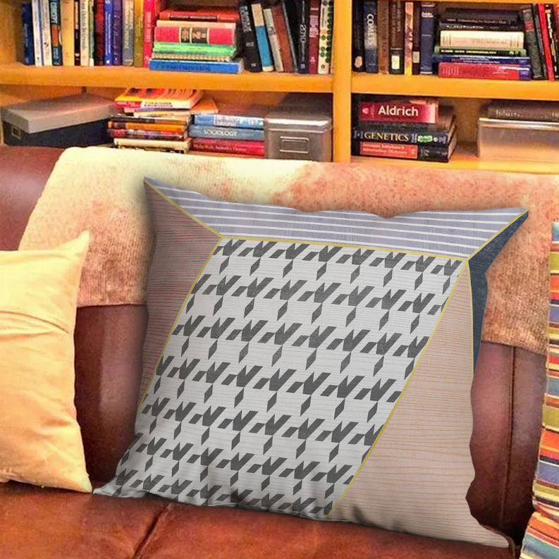 Throw pillow with gray/black/white zigzag pattern and tan textured front panels