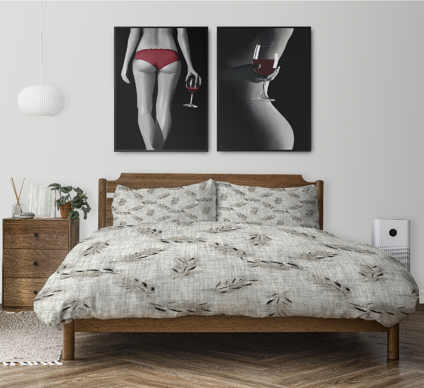 Comforter set with leafy print on light fabric and two matching pillow shams