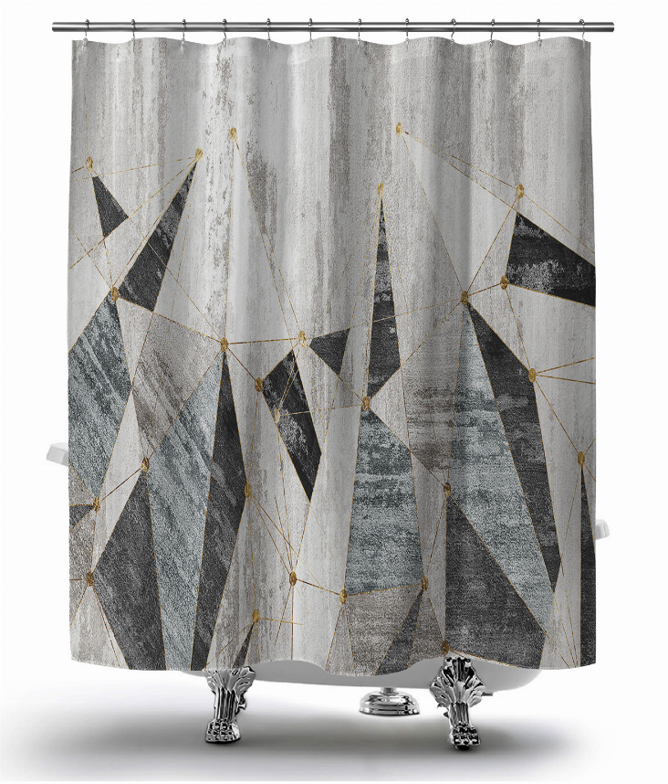 Grey shower curtain with geometric string-art triangles and gold accents, hanging with rings