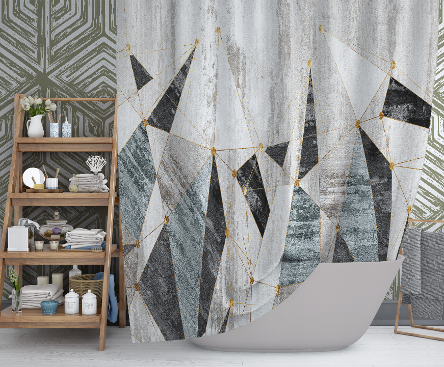 Grey shower curtain with black, teal, and cream geometric panels connected by gold lines