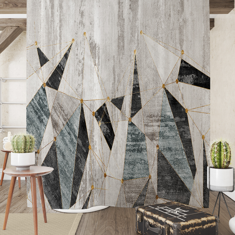 Geometric shower curtain in light grey with black and teal panel triangles, gold lines