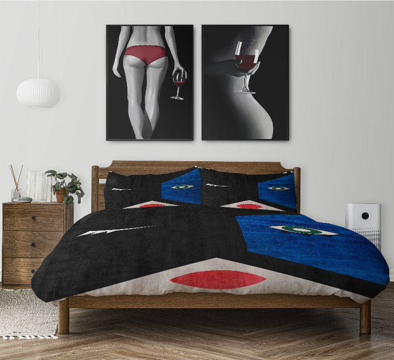 Comforter set with black, blue, white geometric print, red ovals, and matching shams