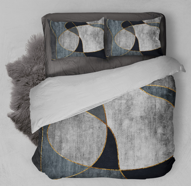 Geometric comforter set with gray and navy circular pattern and gold trim; two shams