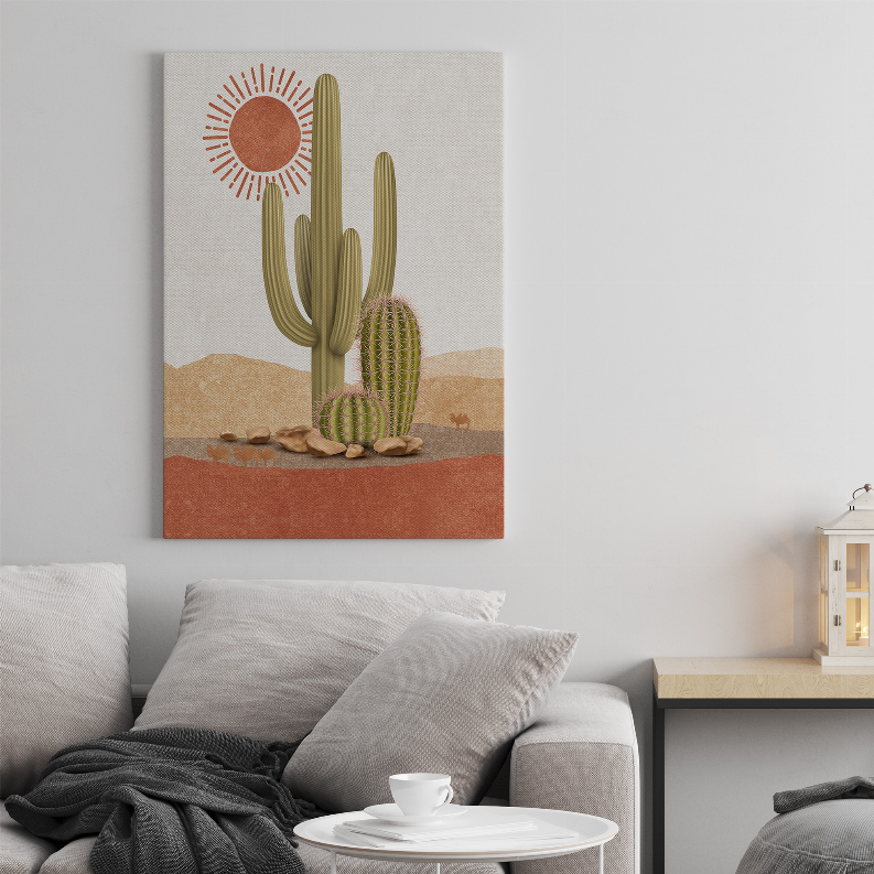 Framed cactus art print featuring green cacti, orange sunburst, and desert ground scene