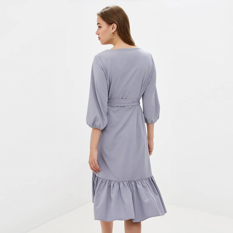 Light blue midi dress, back view, waist tie belt, puff sleeves, tiered ruffle hem