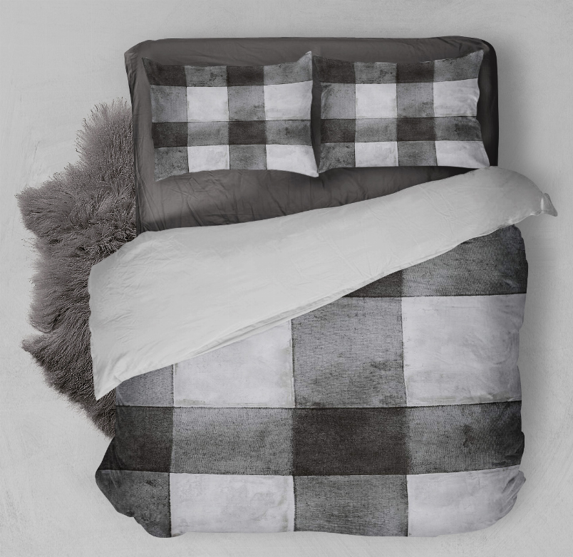Grey and white check comforter and pillowcases in patchwork squares