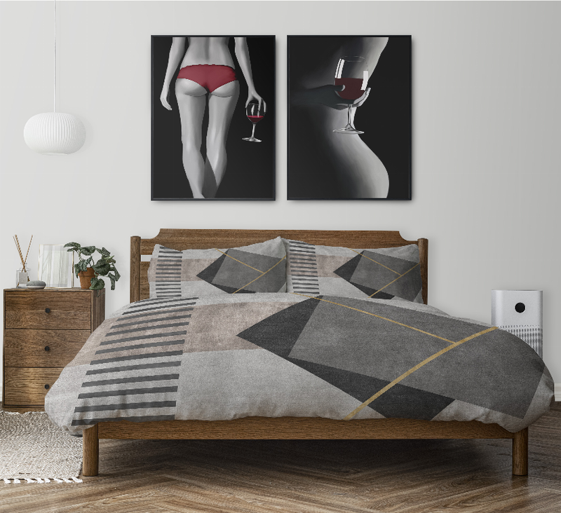 Comforter set on bed with grey and dark geometric squares, striped sections, and yellow outlines