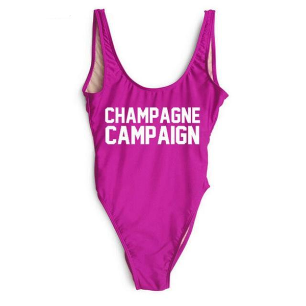 Fuchsia one-piece swimsuit with scoop neckline and white CHAMPAGNE CAMPAIGN print