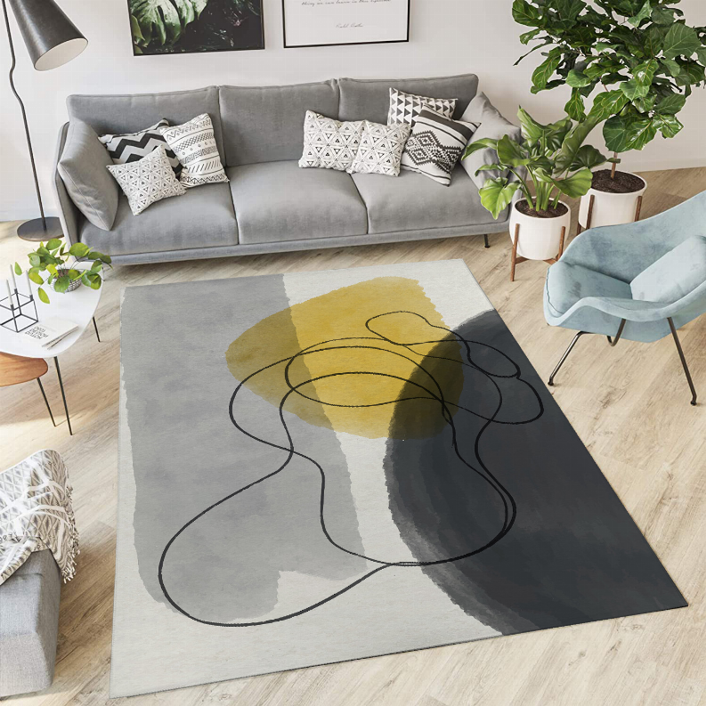 Low pile abstract rug, light gray with mustard yellow blotch and black looping lines