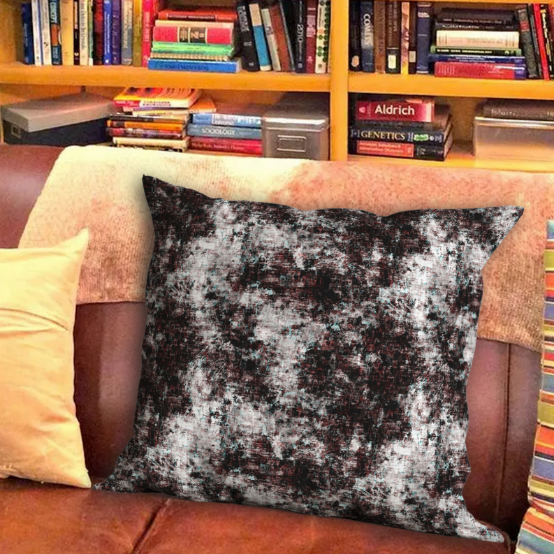 Multi-color abstract speckled throw pillow on couch, square cushion cover
