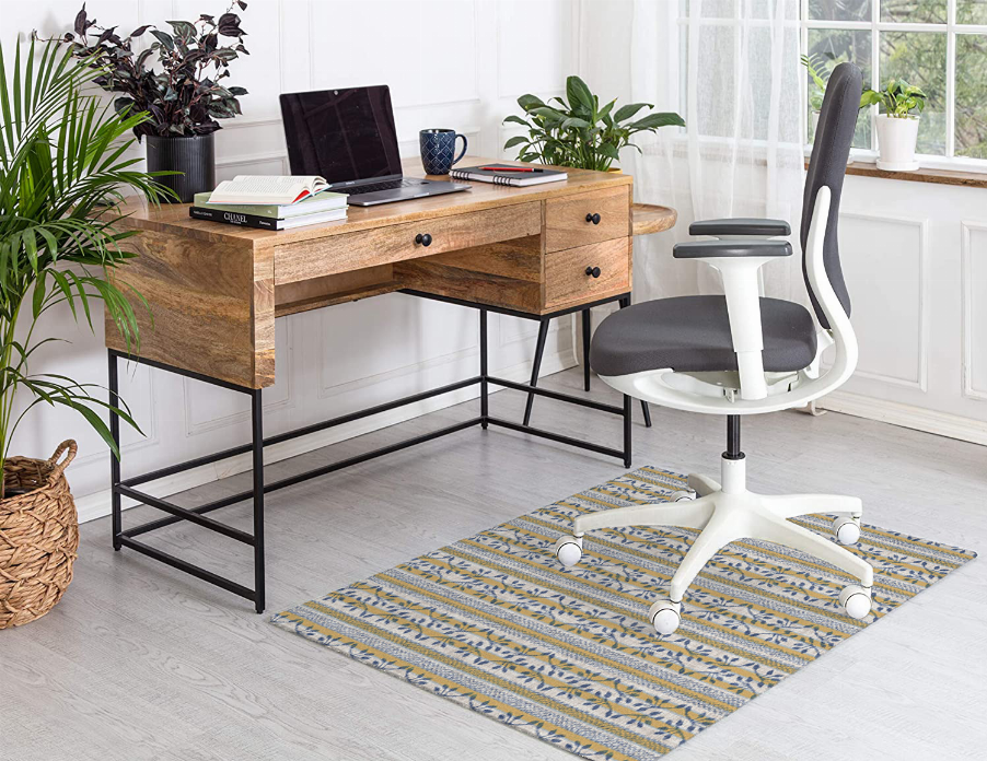 Low pile rug with blue-and-white striped design under office chair