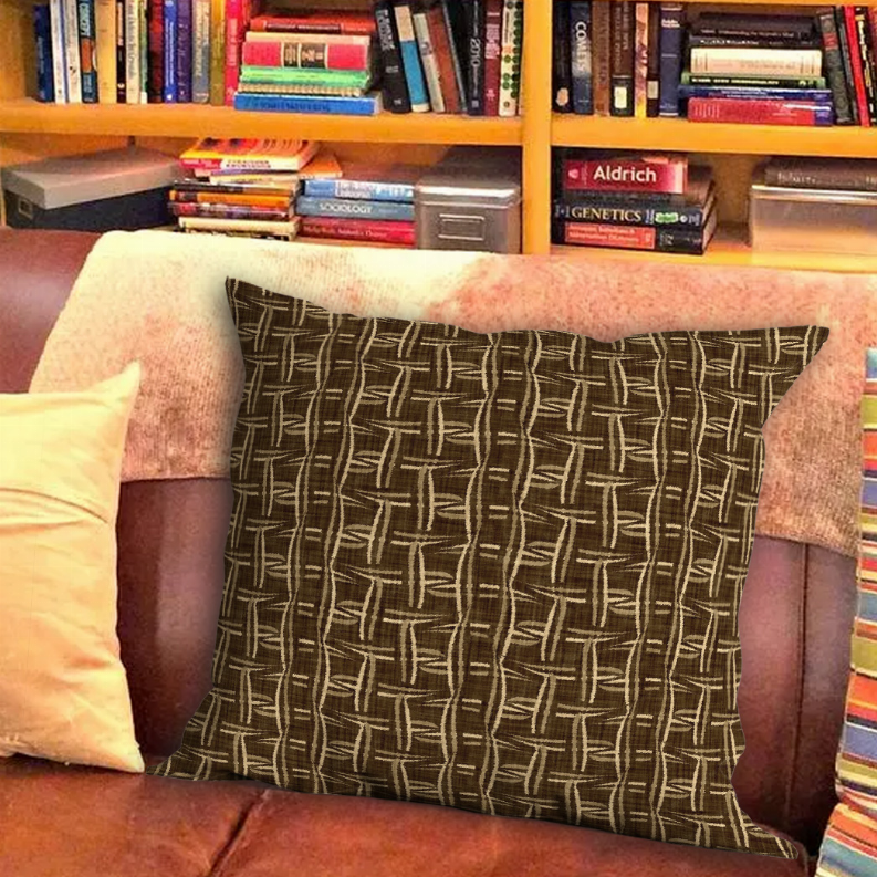 Dark brown throw pillow with woven geometric grid lines in beige