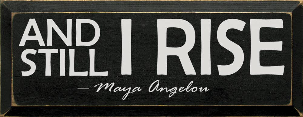 Wood sign text: 'AND STILL I RISE' and 'Maya Angelou'