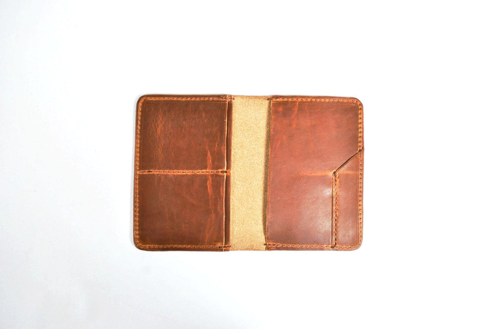 Brown carry wallet with tan center panel, open bifold design and stitched edges