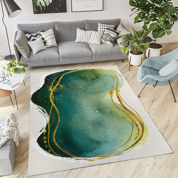 Low pile area rug with abstract teal-green oval and yellow swirls on light background