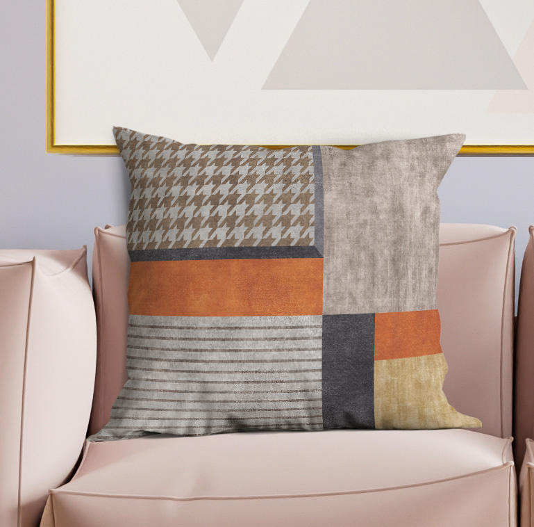 Multicolor patchwork throw pillow with houndstooth, stripes, orange, gray and beige panels