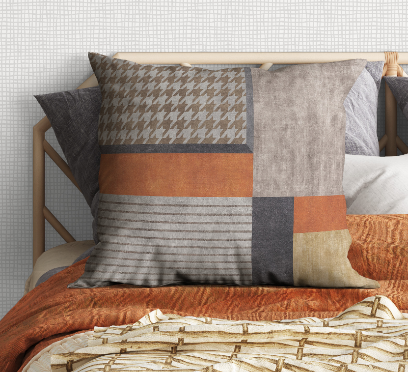 Patchwork accent pillow with houndstooth, striped bands, and solid gray side panel